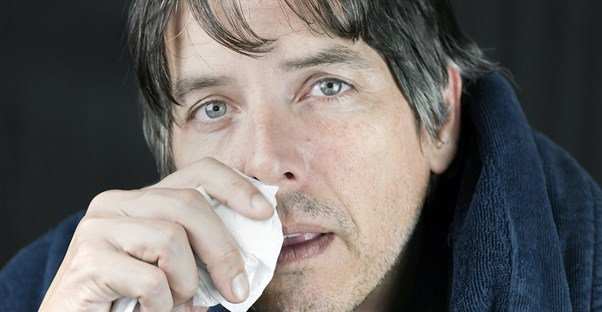 A man with a severe runny nose