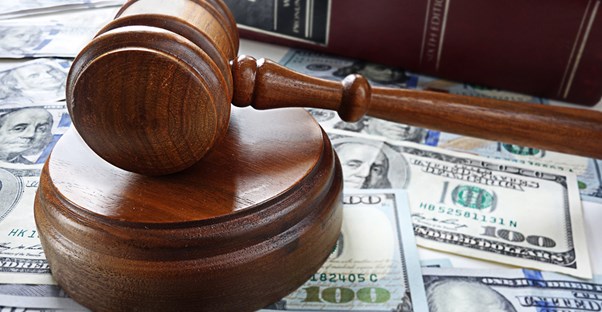 Gavel on a pile of money representing bankruptcy court