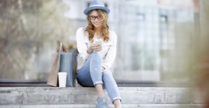 Woman on her phone looking at scholarships