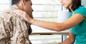 A doctor comforts a ptsd patient