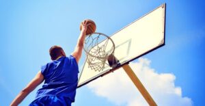 A college athlete plays in a basketball game