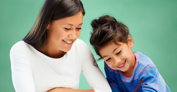 A special education teacher helps a student with homework