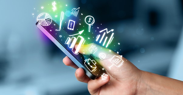 Person holding a phone that can handle several different finance tasks
