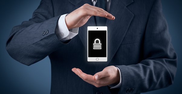 Man gesturing to a phone with a lock on the screen
