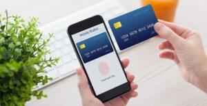 Person paying using a phone in the place of a credit card