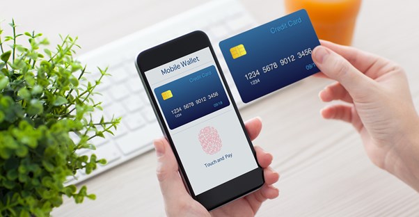 Person paying using a phone in the place of a credit card