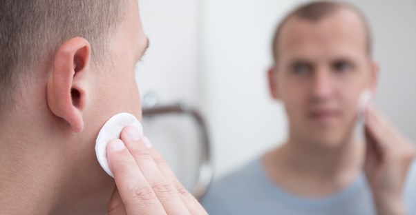 A man treats his ingrown hair