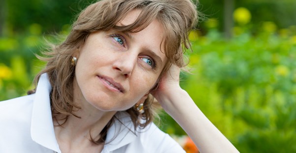 A woman experiences hot flashes