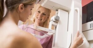 A woman receives a mammogram