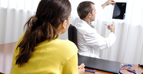 A doctor explains a mammogram