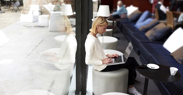Business owner researching merchant account fees