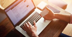 Businessperson looking for a new merchant account provider online