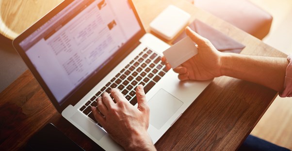 Businessperson looking for a new merchant account provider online