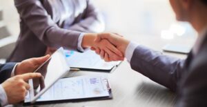 Businesspeople shaking hands over a business account deal