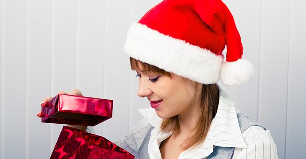 Woman opening an employee recognition gift