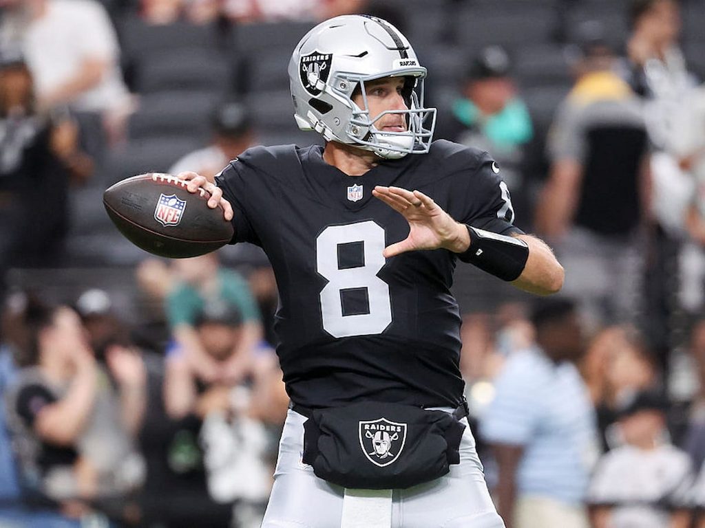 Kirk Cousins prepares to throw the football during a preseason Raiders game.
