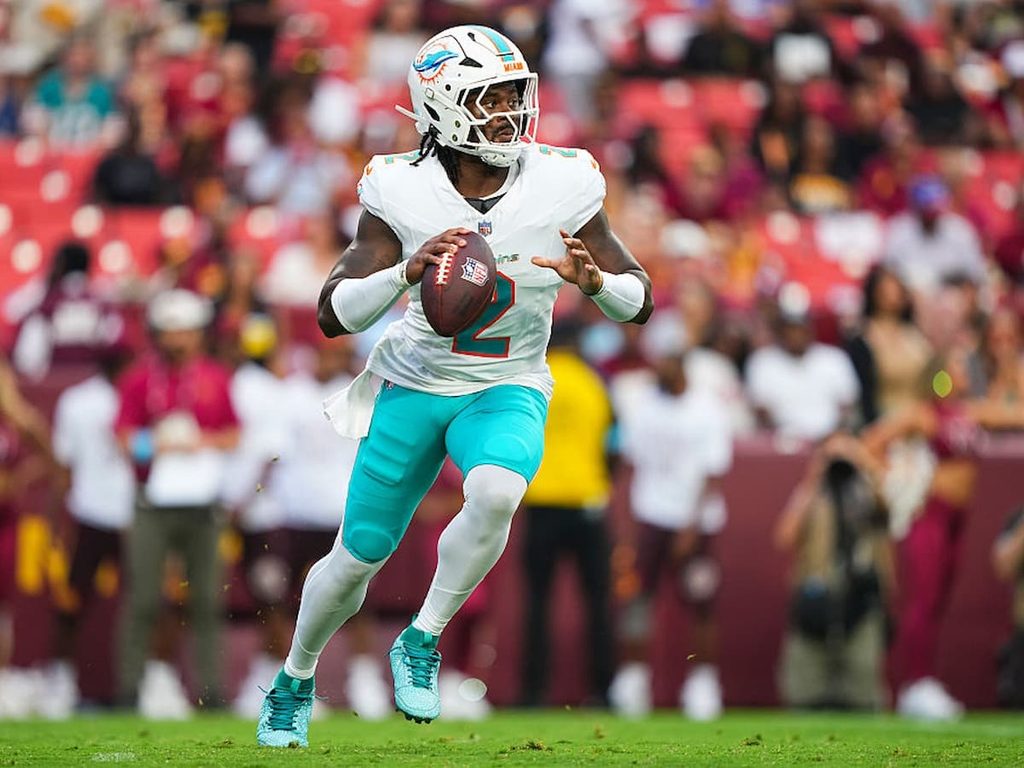 Quarterback Malike Willis looks for a player downfield during a Dolphins game.
