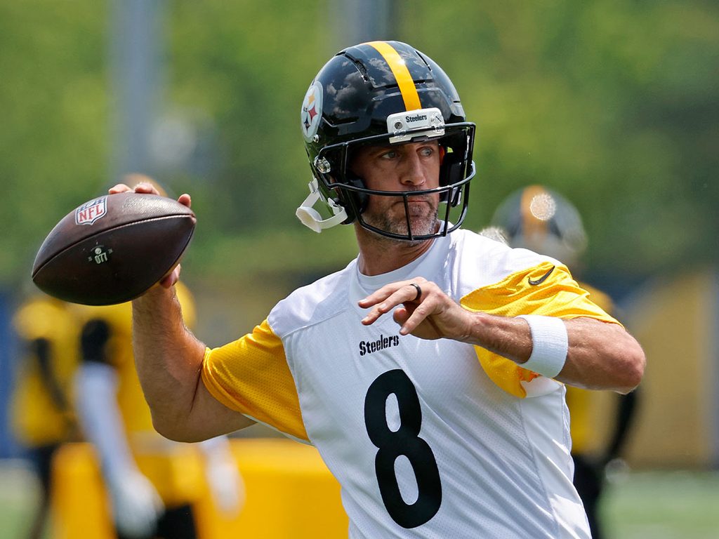 Aaron Rodgers leans back to throw the football at a Steelers practice session.