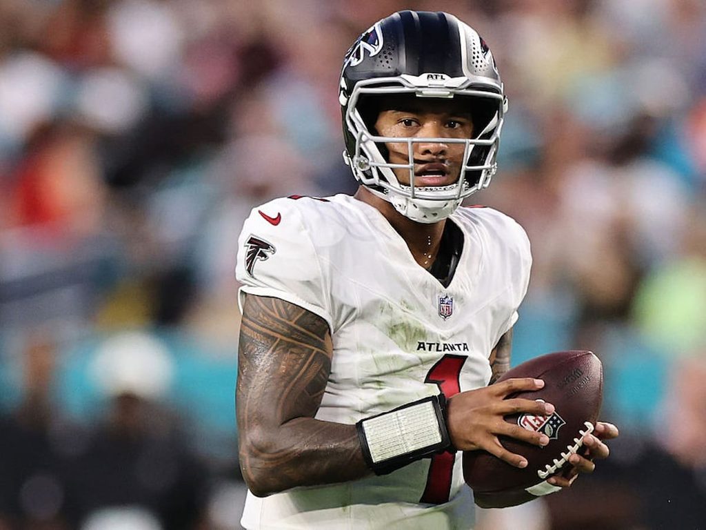 Tua Tagovailoa holds the ball during a preseason game for the Atlanta Falcons.