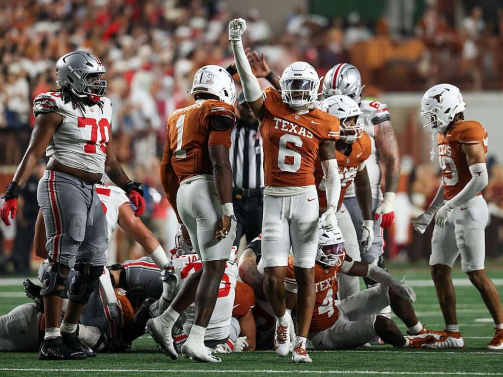 Georgia Bulldogs wide receiver London Humphreys high fives his teammates after a successful play.