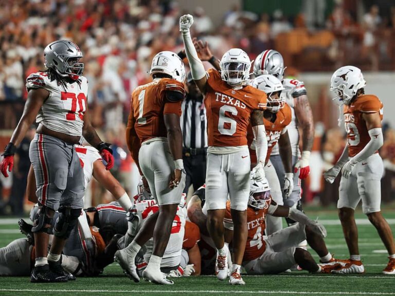 Georgia Bulldogs wide receiver London Humphreys high fives his teammates after a successful play.