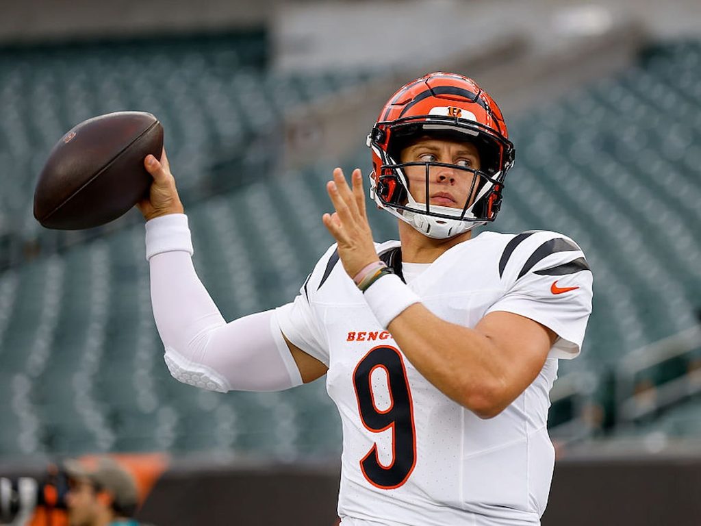 Bengals quarterback Joe Burrow throws a ball during warm up before a game.