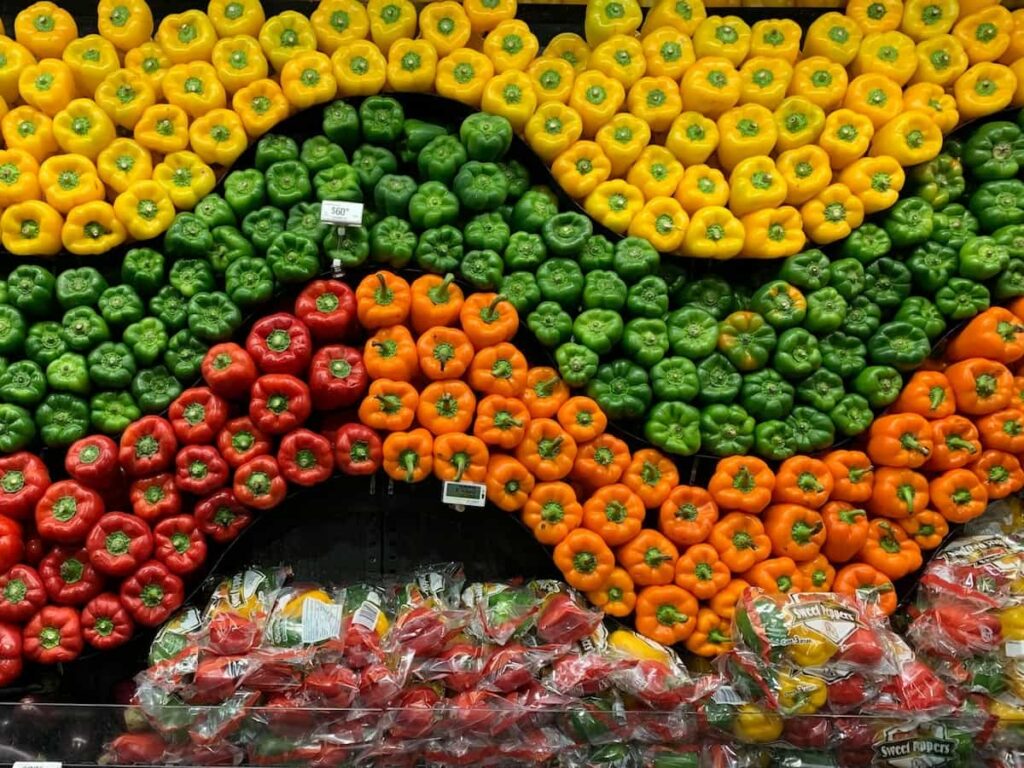 Bell peppers displayed at a grocery store that are not recalled.