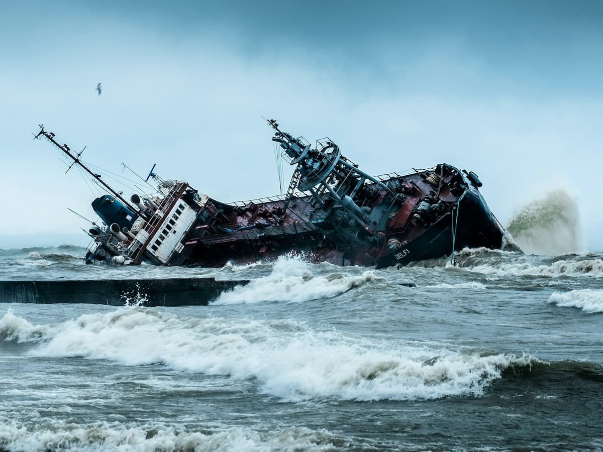 A ship wrecks and overturns in dangerous rough water during a Pacific hurricane.