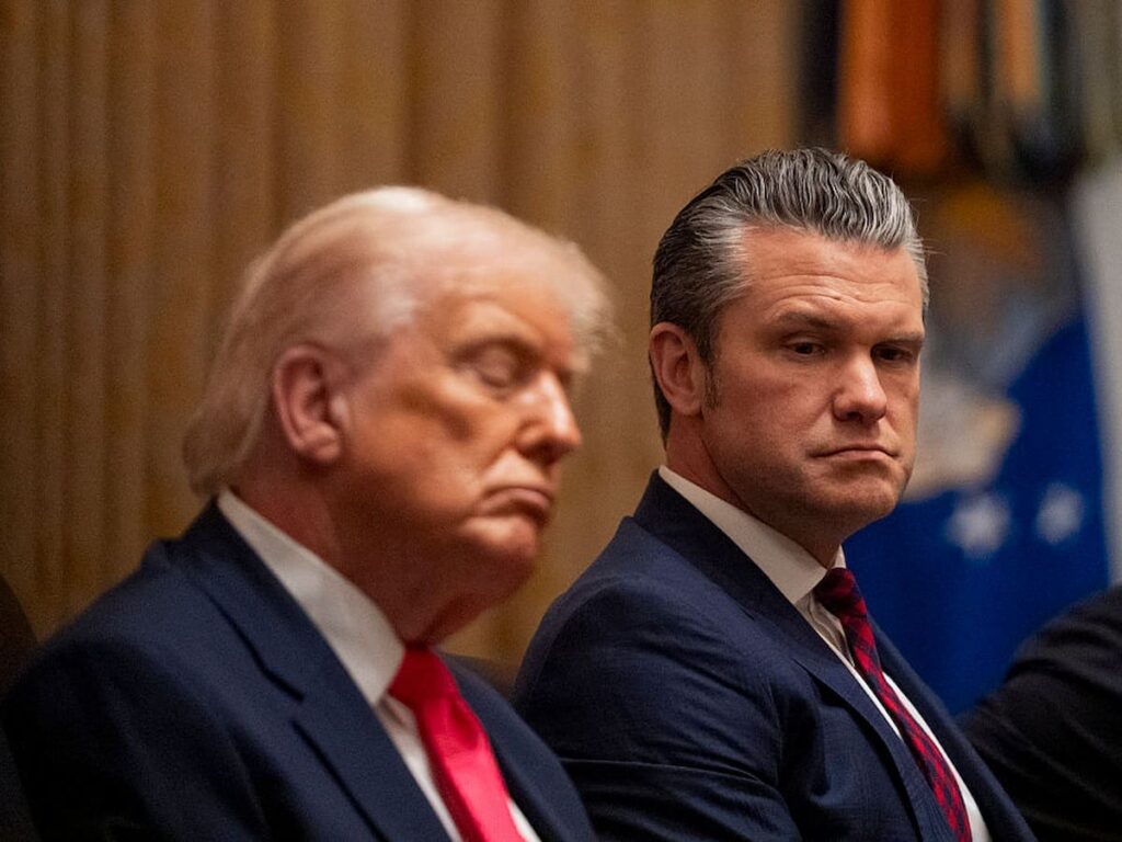 President Donald Trump appears to fall asleep next to Defense Secretary Pete Hegseth during a cabinet meeting at the White House in December 2025.