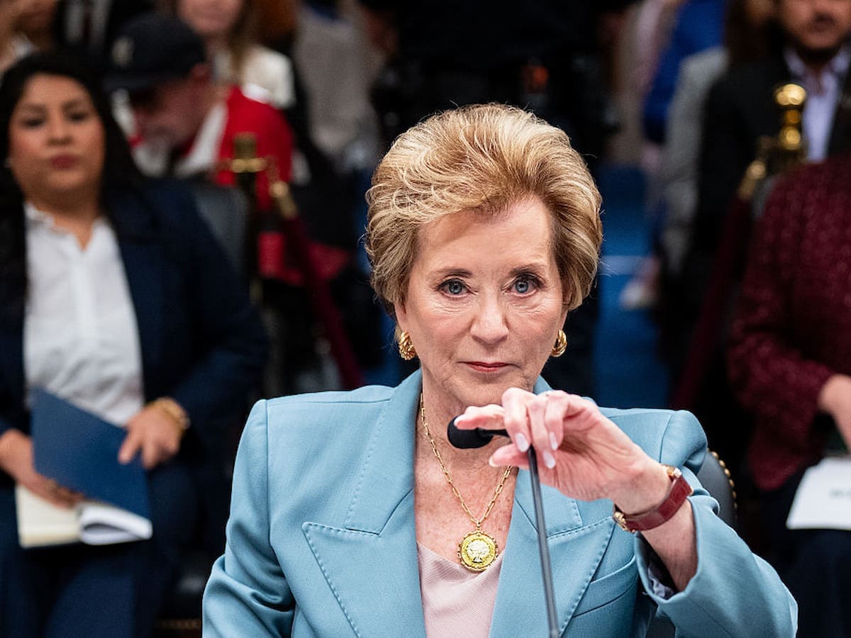 Secretary of Education Linda McMahon adjusts her microphone before the start of a Senate Appropriations Subcommittee hearing.